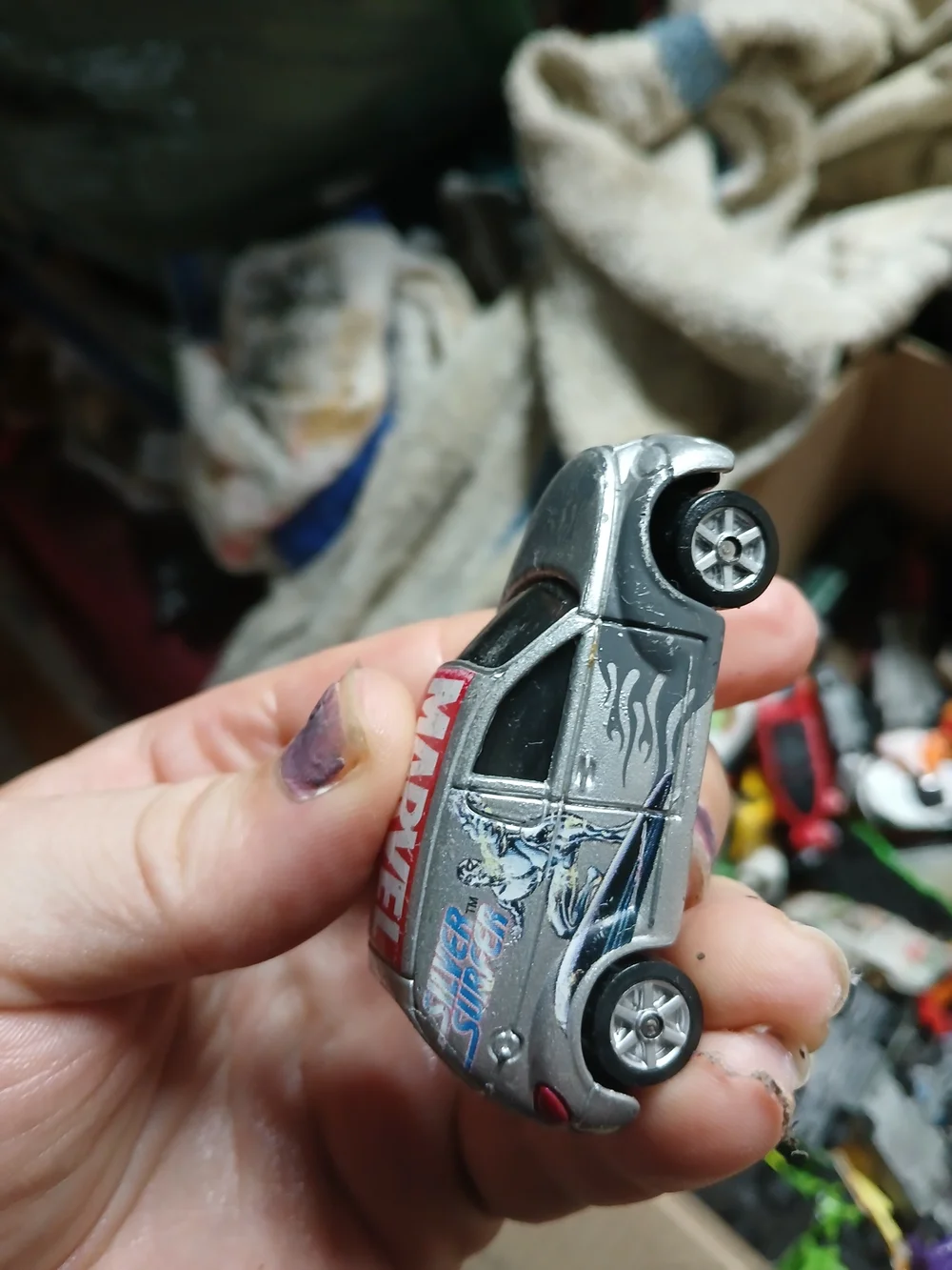 1:64 scale 2002 Maisto Chrysler Panel Cruiser featuring the Silver Surfer